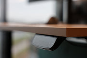 Close-up of a wooden surface with a metallic handle